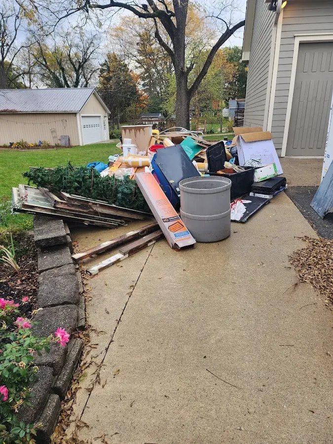 Dumpster being loaded with debris for Demolition Dumpster Rental in Carmel-by-the-Sea